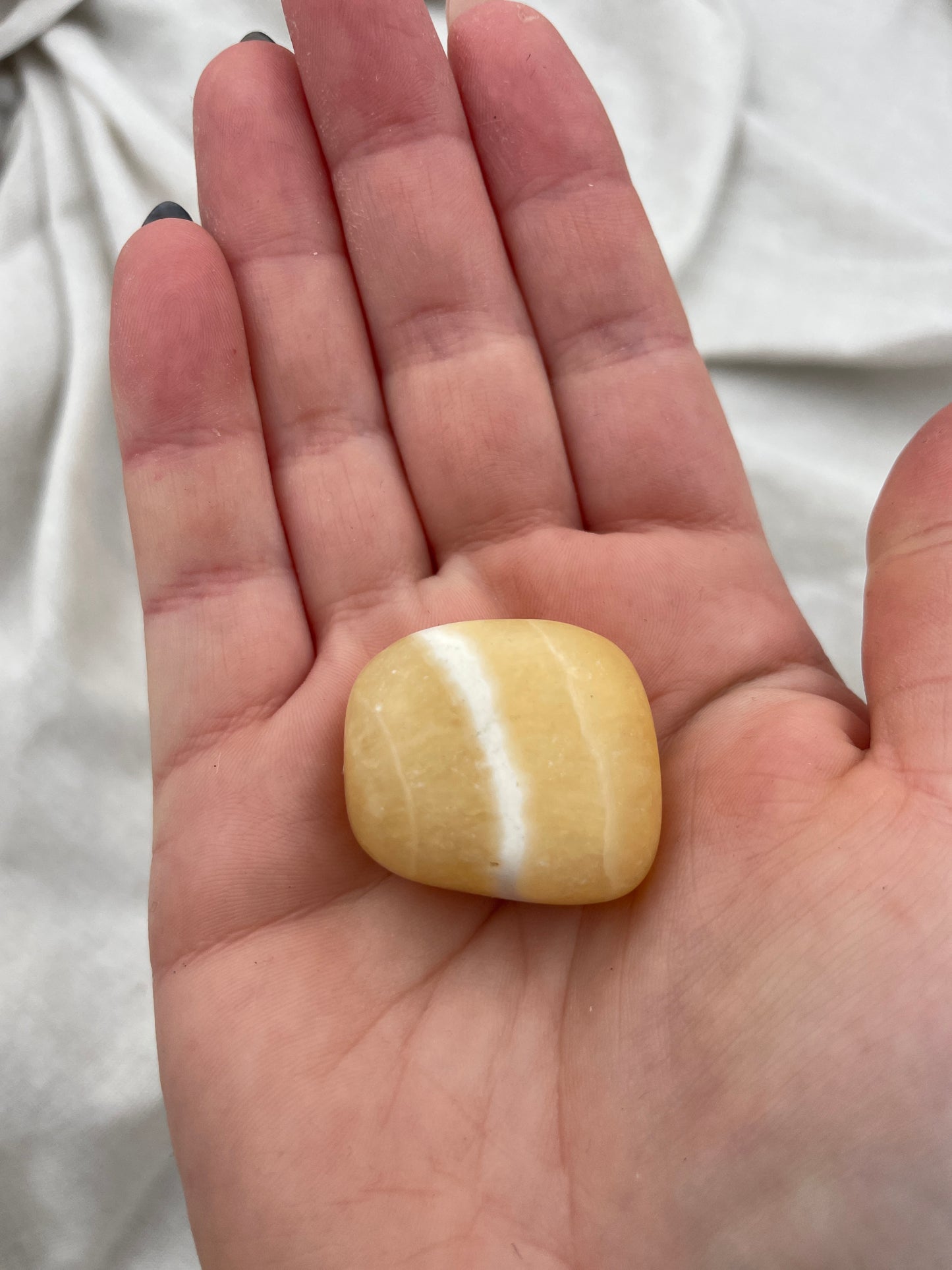 Calcit orange Trommelstein